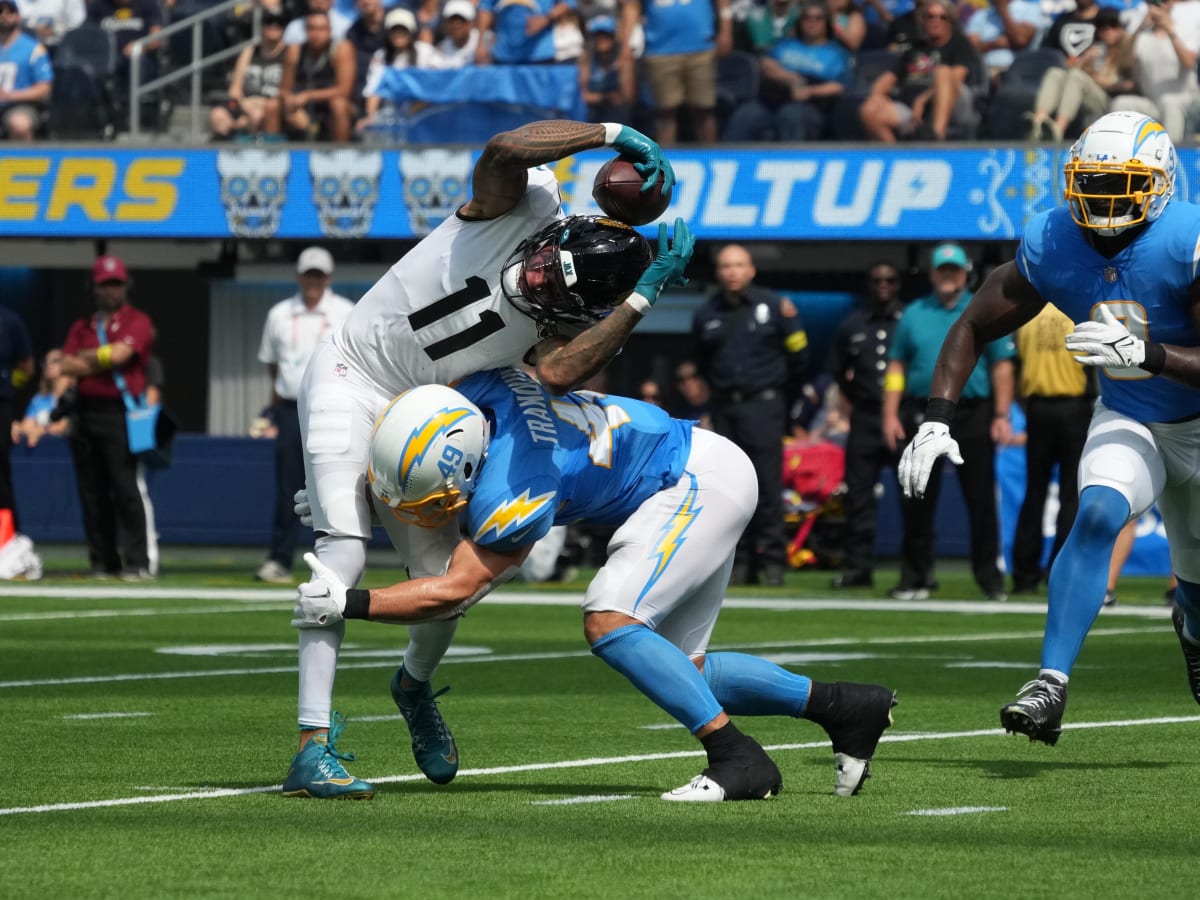 JACKSONVILLE, FL - JANUARY 14: Jacksonville Jaguars cornerback Tre Herndon  (37) runs with the ball during the game between the Los Angeles Chargers  and the Jacksonville Jaguars on January 14, 2023 at