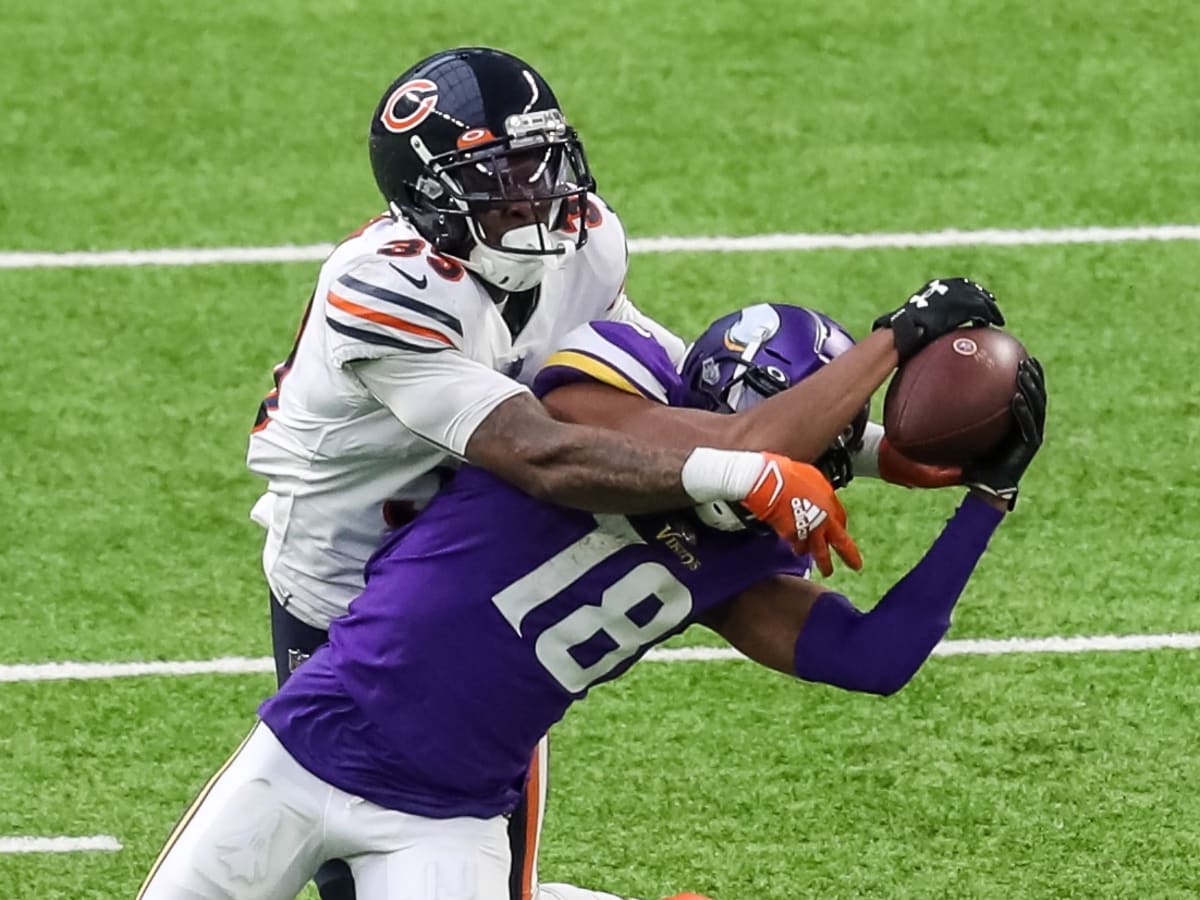 Chicago Bears safety Jaquan Brisker (9) makes a diving attempt at an  incomplete pass ahead of Minnesota Vikings wide receiver Justin Jefferson  during the first half of an NFL football game, Sunday