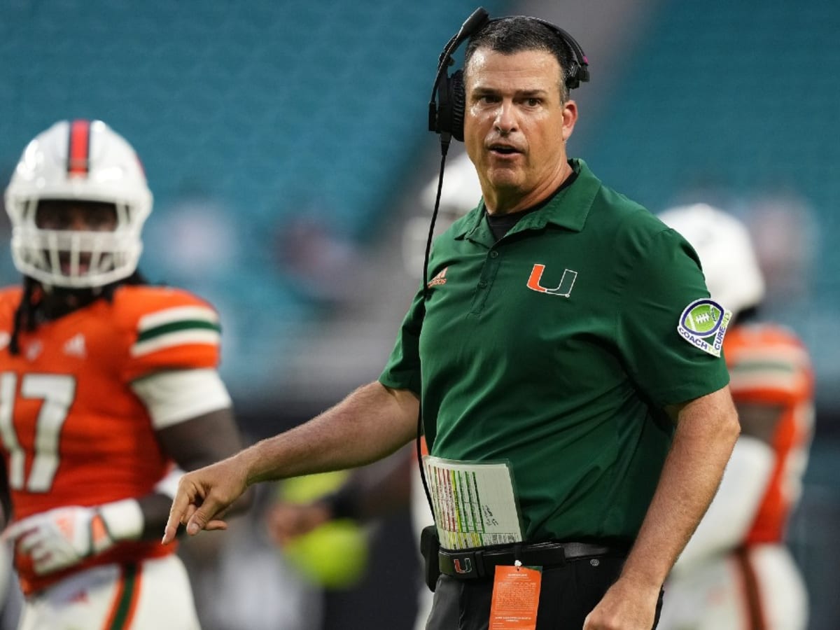 September 2, 2018: Miami Hurricanes running back DeeJay Dallas #13 is hit  as he carries the ball in the Advocare Classic NCAA Football game between  the University of Miami Hurricanes and the