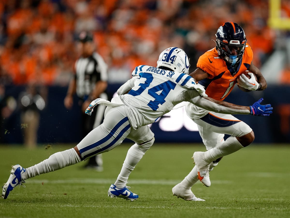 Denver Broncos wide receiver K.J. Hamler (13) goes airborne after getting  hit by Las Vegas Raid …