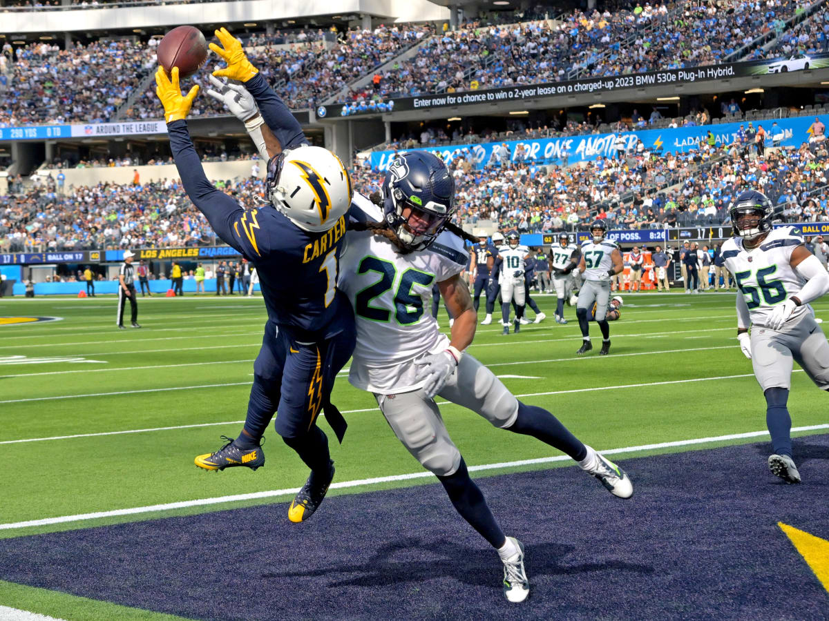 Seattle Seahawks safety Ryan Neal (26) celebrates after a play during the  first half of an NFL football game against the Los Angeles Chargers Sunday,  Oct. 23, 2022, in Inglewood, Calif. (AP