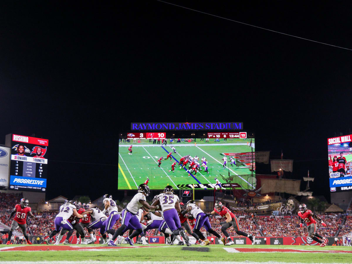 Baltimore Ravens running back Gus Edwards (35) runs past Tampa Bay