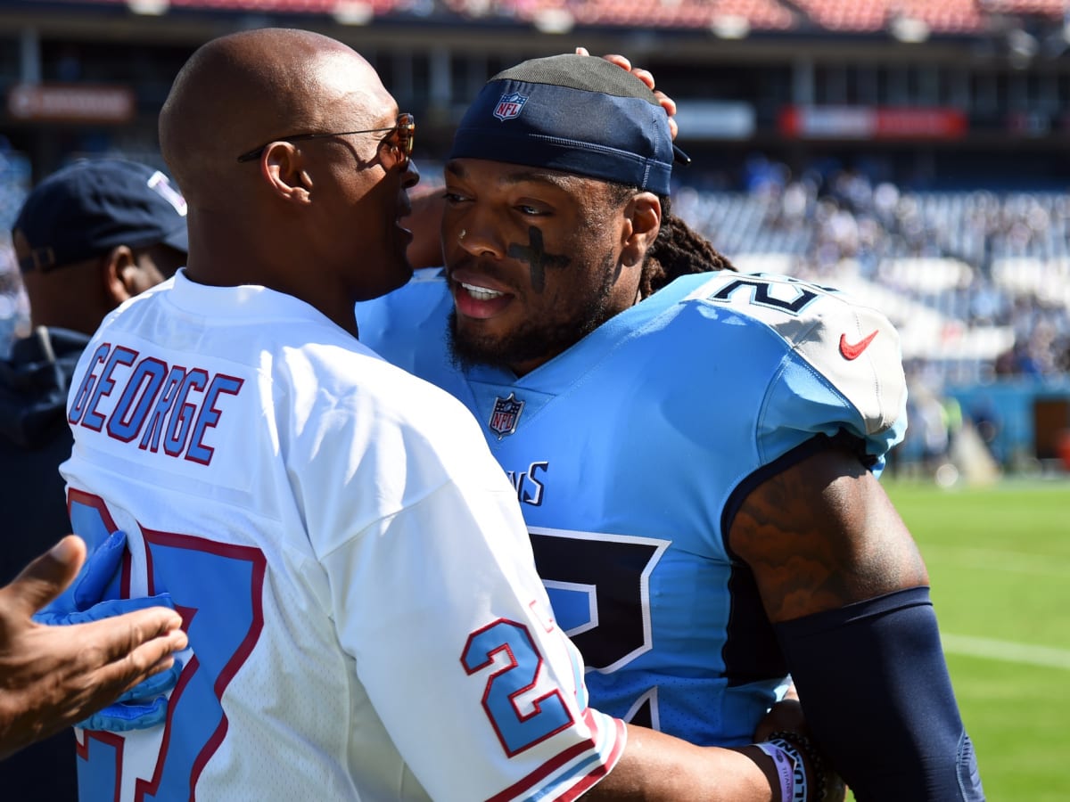 Eddie George of the Tennessee Titans carries the ball during the game