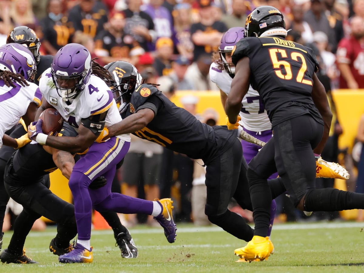 Washington Commanders quarterback Taylor Heinicke (4) in action during the  first half of an NFL football game against the Minnesota Vikings, Sunday,  Nov. 6, 2022, in Landover, Md. (AP Photo/Nick Wass Stock