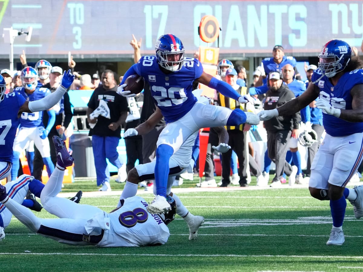 New York Giants safety Julian Love (20) wears decals of the