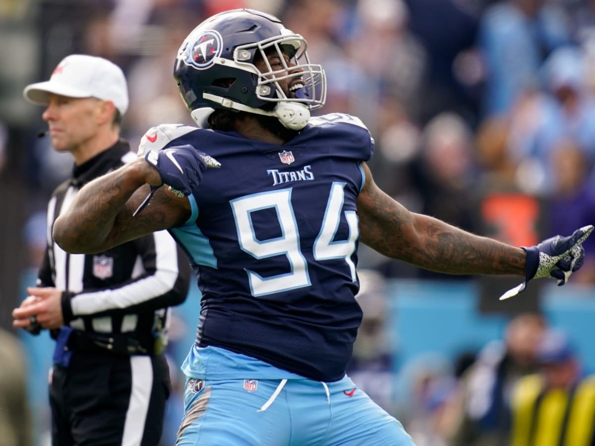 Tennessee Titans cornerback Terrance Mitchell (39) intercepts a pass by  Denver Broncos quarterback Russell Wilson during the second half of an NFL  football game Sunday, Nov. 13, 2022, in Nashville, Tenn. (AP