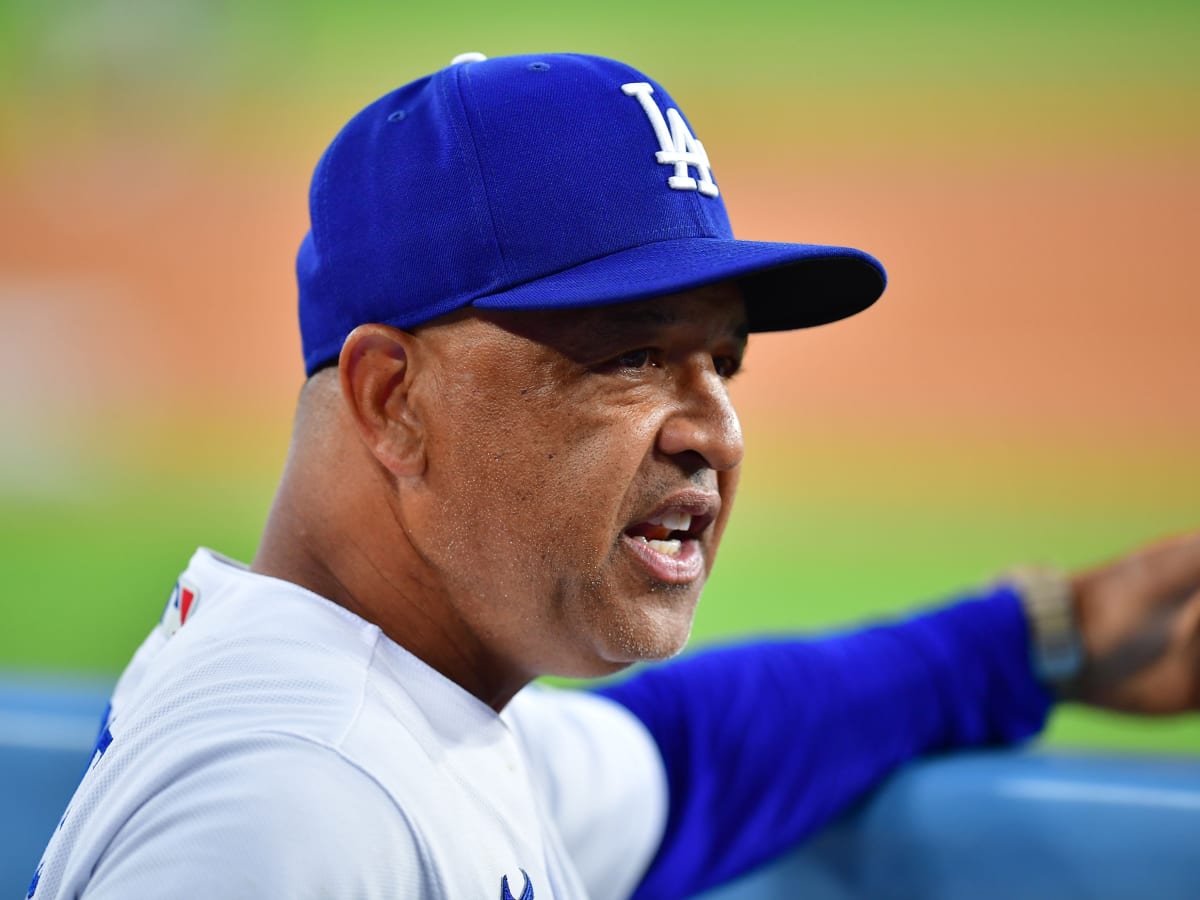 Dave Roberts, a former Dodger dons his new jersey as he is introduced as  the 10th manager of the Los Angeles Dodgers and the 28th in franchise  history, saying the post was