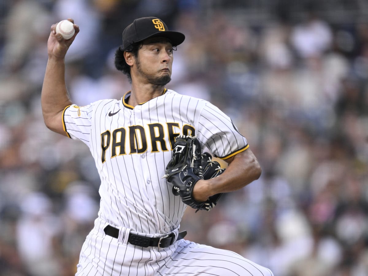 San Diego Padres' Yu Darvish, left, poses for a photo with his wife Seiko  Darvish at a baseball news conference, Friday, Feb. 10, 2023, in San Diego.  Darvish signed a new contract