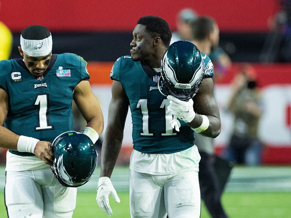 Philadelphia Eagles wide receiver A.J. Brown (11) and quarterback Jalen  Hurts (1) talk after an NFL