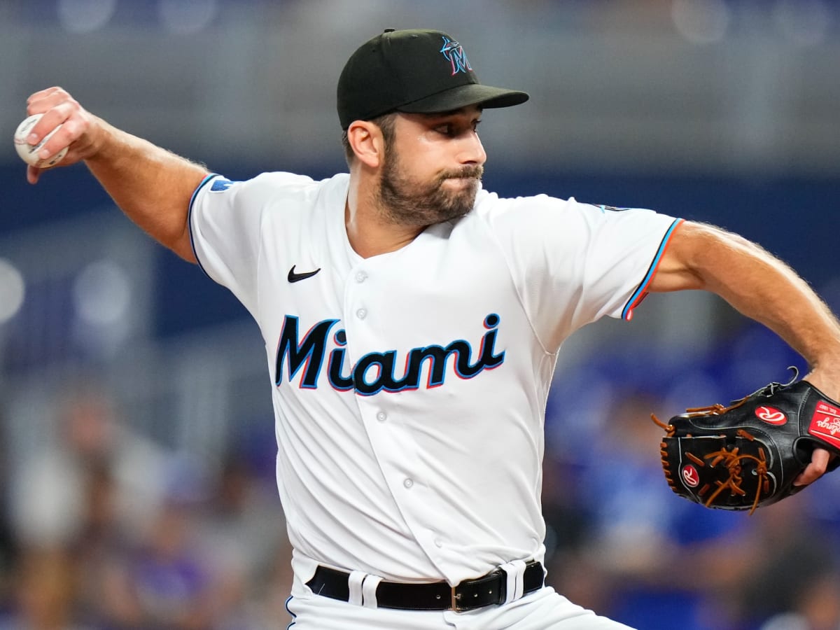 Marlins lose opener to Brewers, narrowly avoid shutout