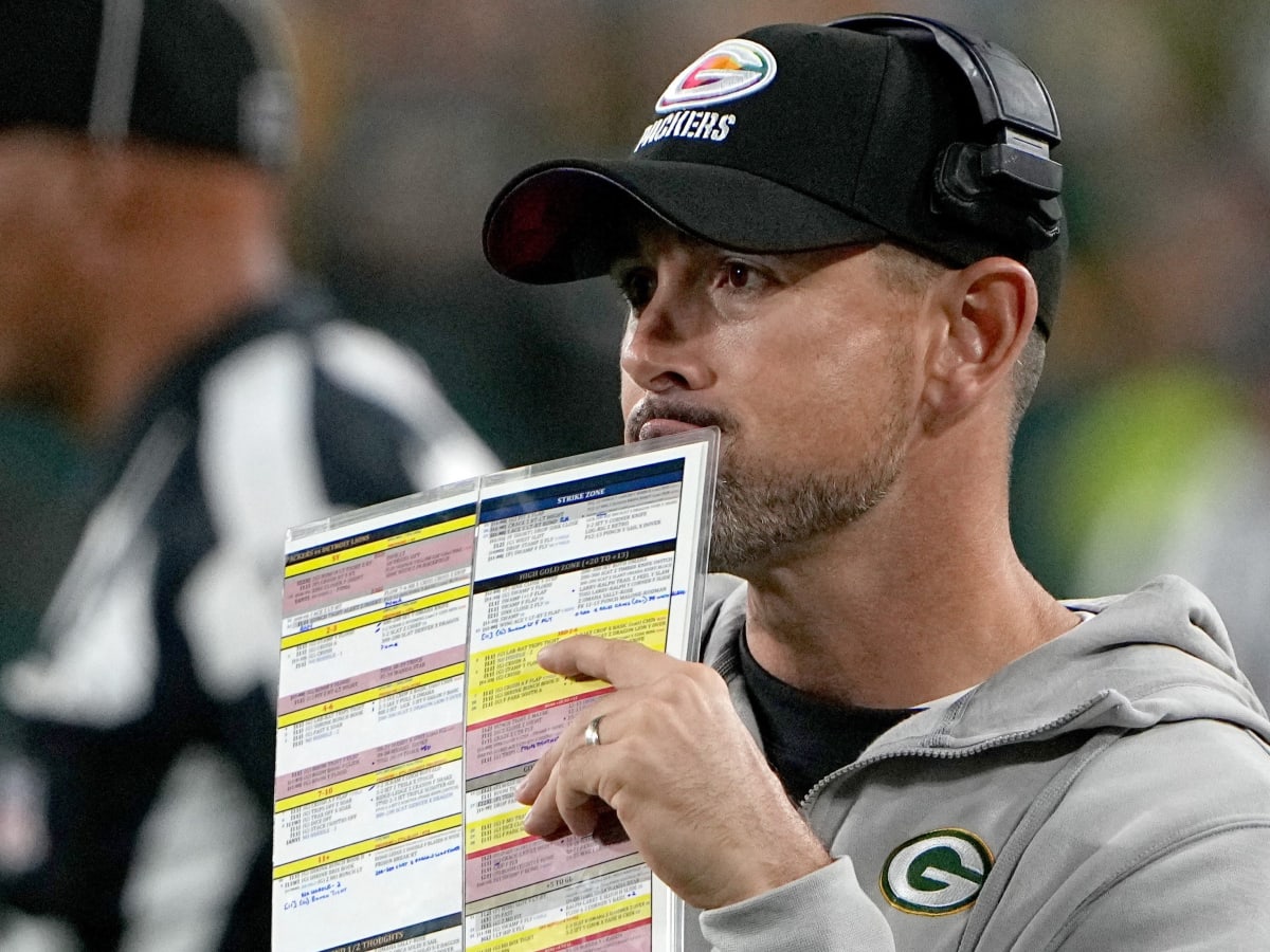 Detroit Lions hold up signs on a third down play against the