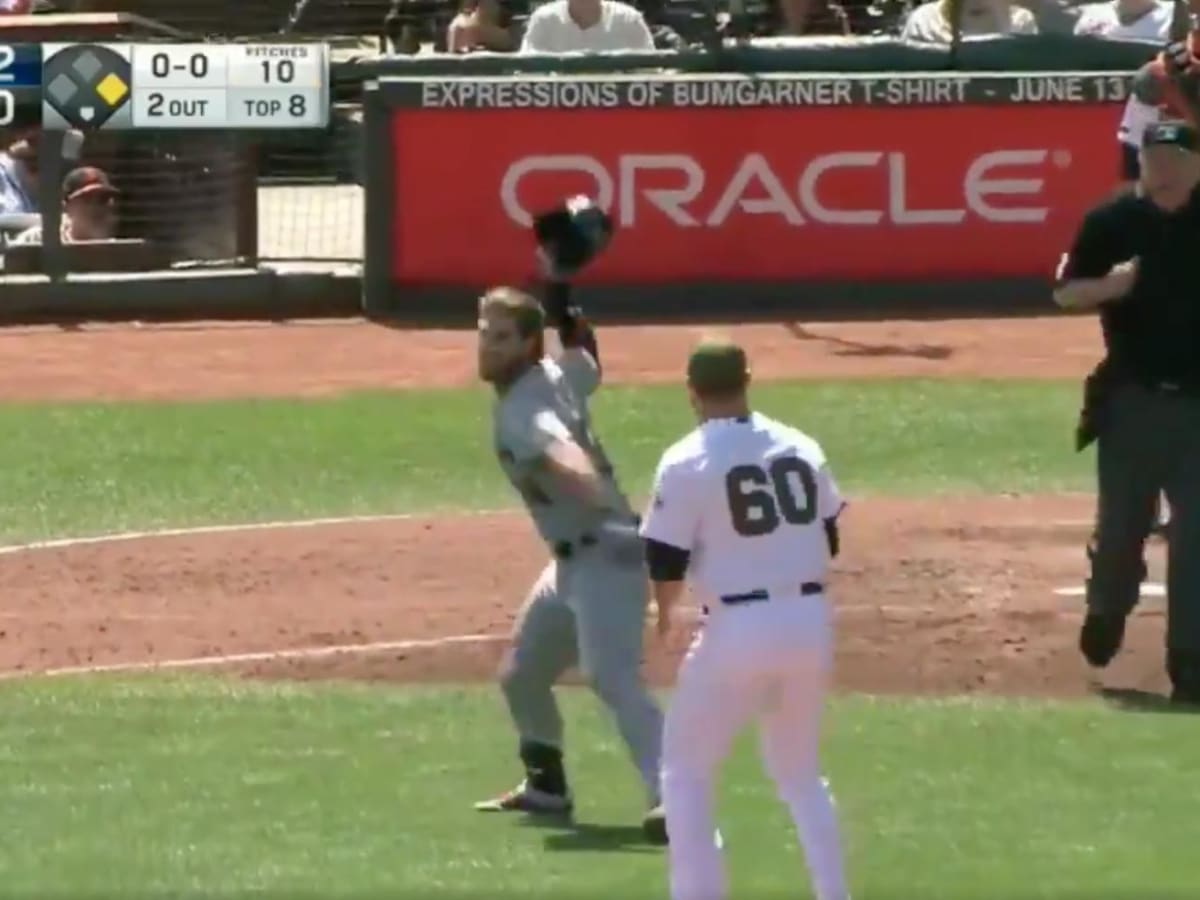 Bryce Harper tosses helmet into the stands where it's retrieved by