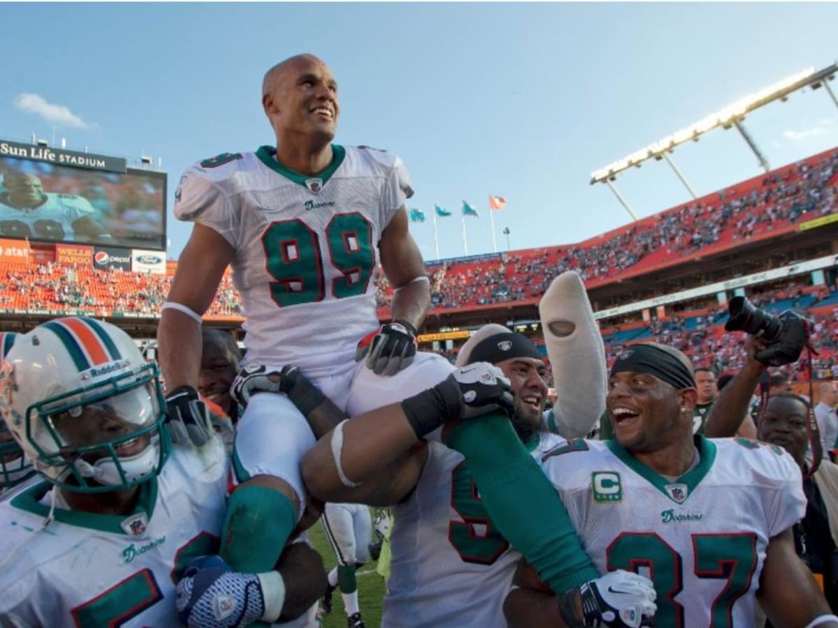 Miami Dolphins linebacker Jason Taylor (99) Enters the field for his last  game during first half action, between the Miami Dolphins, and the New York  Jets January 1, 2012 at Sun Life