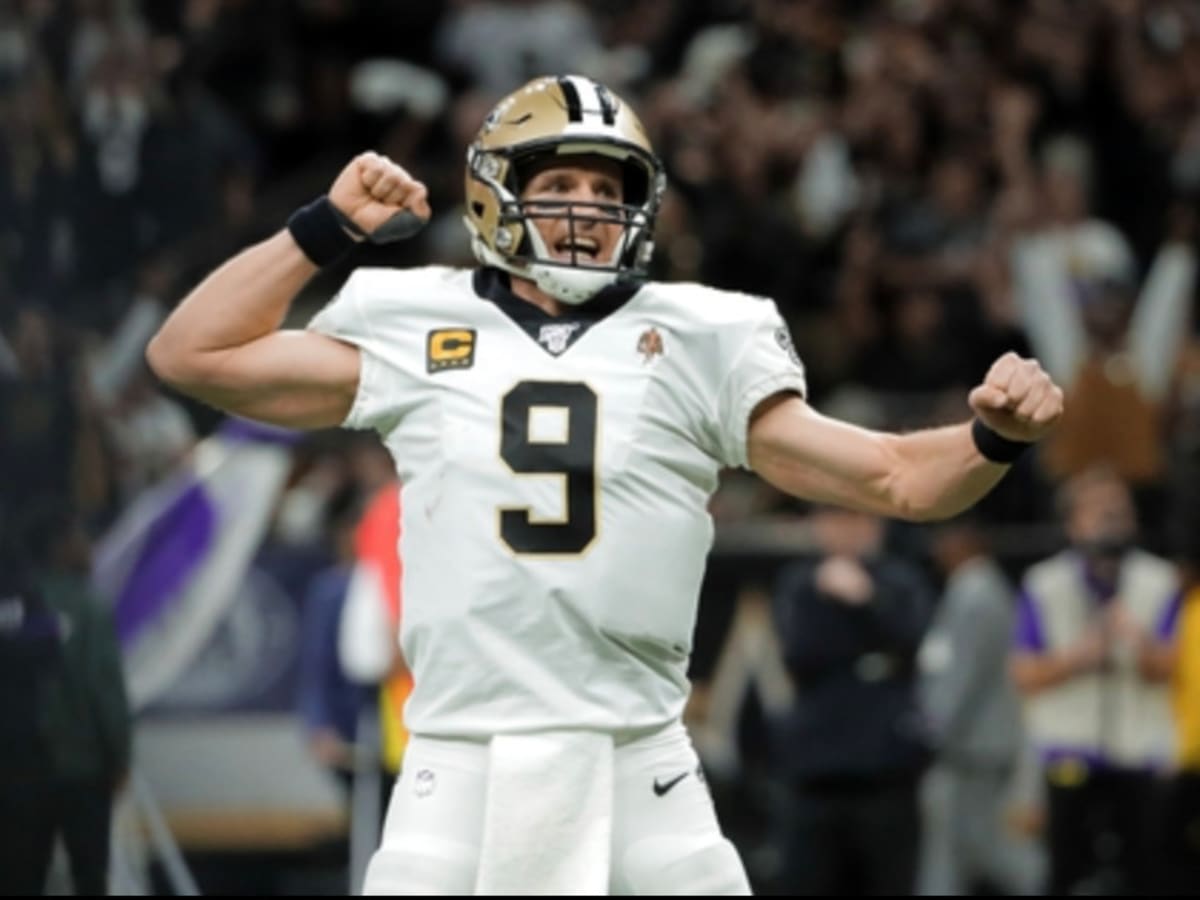 Quarterback Drew Brees of the Purdue Boilermakers points down the News  Photo - Getty Images