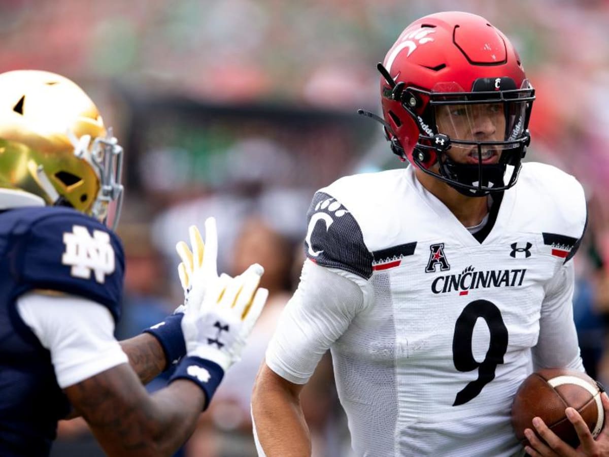 Desmond Ridder shines as No. 7/8 Cincinnati defeats No. 9/7 Notre Dame  24-13 in South Bend