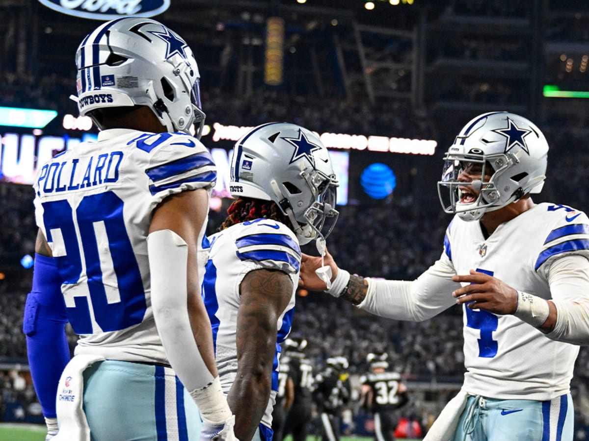 Dallas Cowboys' CeeDee Lamb (88), Dak Prescott (4) and Tony Pollard (20)  celebrate after Lamb scored a touchdown during the first half of an NFL  football game against the Green Bay Packers