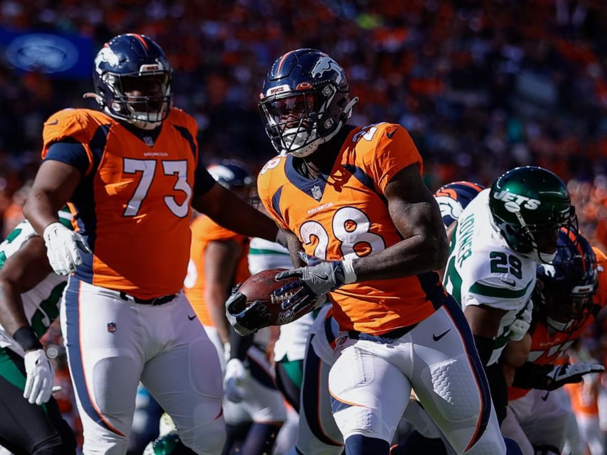 Denver Broncos offensive tackle Cam Fleming watchs the action from