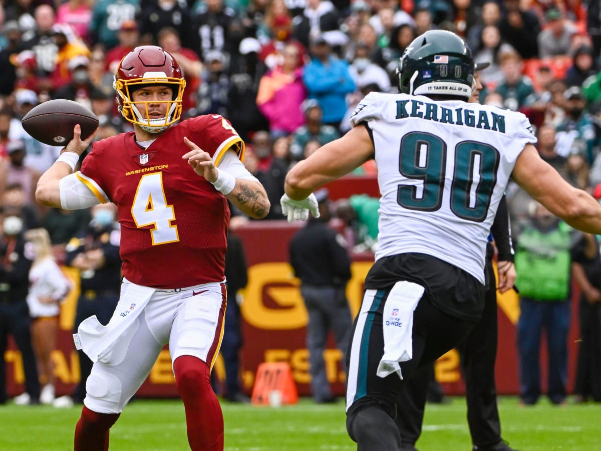 Philadelphia Eagles defensive end Ryan Kerrigan (90) warming up on the  field before the start of the first half of an NFL football game, Sunday,  Jan. 2, 2022, in Landover, Md. (AP