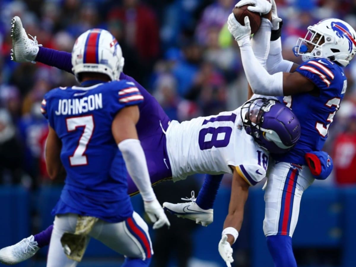 Minnesota Vikings wide receiver Justin Jefferson (18) makes an incredible  catch in front of Buffalo Bills safety Cam Lewis (39) during the second  half of an NFL football game in Orchard Park