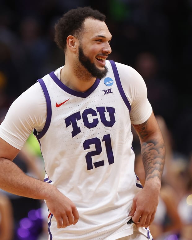 TCU Horned Frogs forward JaKobe Coles (21) reacts after defeating the Arizona State Sun Devils in the first round of the NCAA tournament at Ball Arena.