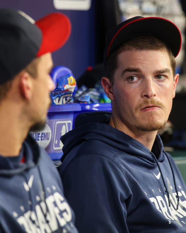 Sep 29, 2023; Atlanta, Georgia, USA; Atlanta Braves starting pitcher Max Fried (54) talks to starting pitcher Charlie Morton (50) in the dugout against the Washington Nationals in the third inning at Truist Park.