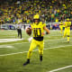 Oregon Ducks quarterback Bo Nix runs vs. Washington.