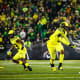 Oregon Ducks defenisve lineman Brandon Dorlus rushes the passer against the Washington Huskies.