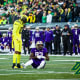 Oregon Ducks safety Bryan Addison stares down Washington Huskies tight end Devin Culp.