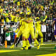 Oregon Ducks linebacker Noah Sewell and Bennett Williams celebrate an interception&nbsp;against the Washington Huskies.