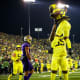 Oregon Ducks running back Noah Whittington celebrates a touchdown with offensive lineman Marcus Harper II.