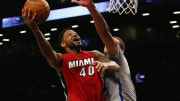 Wade and Bosh each score 27, Heat beat Nets 102-98