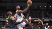 Cousins has 24 points, 15 rebounds as Kings beat Hawks 91-88