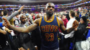 Watch: LeBron James throws down reverse dunk, high-fives fan