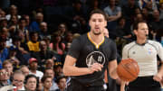 Warriors hold off Nuggets; Faried taken off on stretcher