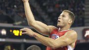 Griffin leads Clippers past Kings 111-104 in opener