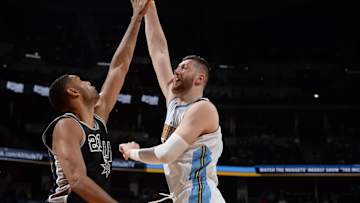 Tim Duncan, depleted Spurs fall to Nuggets 102-98