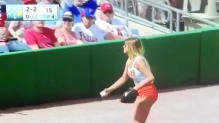 Watch: Hooters ball girl makes physics-defying throw