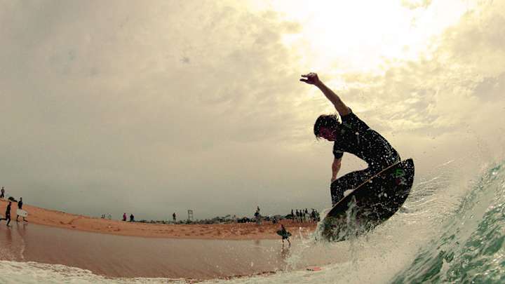 Skimming or surfing? Brad Domke's wave-riding seemingly defies physics