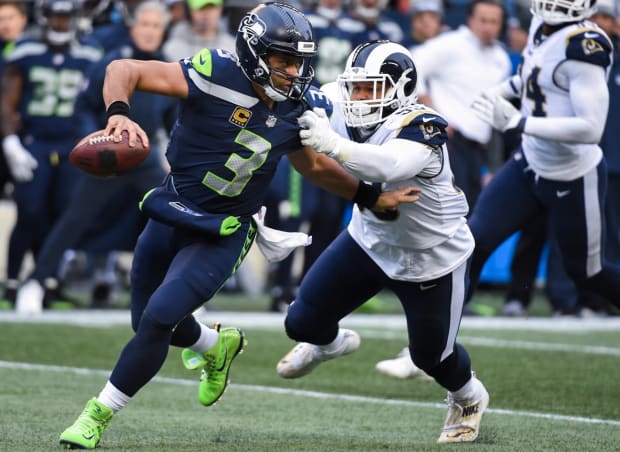 NFL on ESPN - Russell Wilson pulled up in a Kobe jersey and the Grinches 