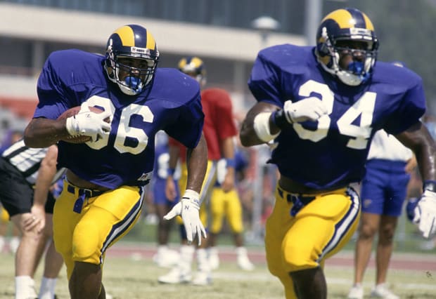 Running backs Jerome Bettis (36) and Tim Lester work on their form at Rams