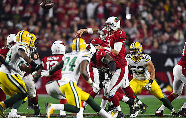 Arizona Cardinals' Larry Fitzgerald aided by Hines Ward