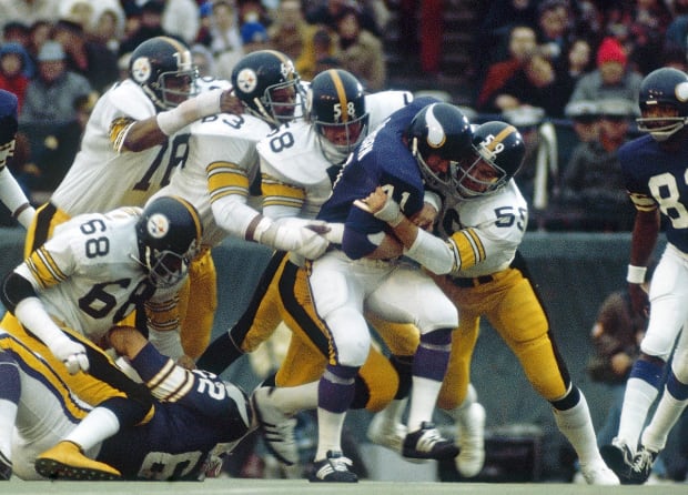 Oakland Raiders defensive end Otis Sistrunk sacks Fran Tarkenton, forcing  the Minnesota Vikings quarterback to fumble. Oakland's offense had a field  day with the Vikings, setting a Super Bowl record with 429