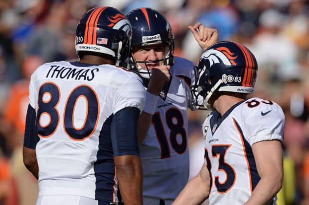 Denver Broncos tight end Julius Thomas (80) watches as the pass