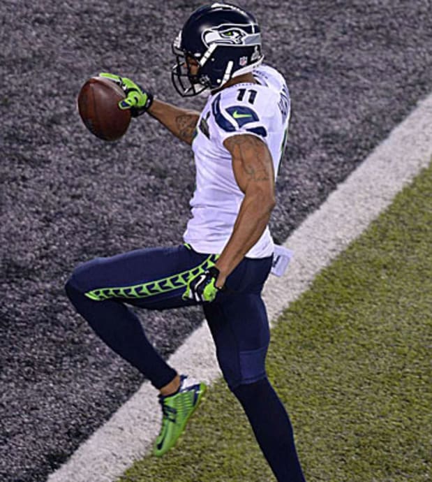 Seattle Seahawks wide receiver Percy Harvin (11) runs the opening kick off  of the second half for a 87 yard touchdown at the Super Bowl XLVIII at  MetLife Stadium in East Rutherford