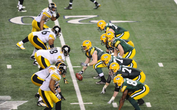 Green Bay Packers cornerback Charles Woodson breaks up a pass intended for  Pittsburgh Steelers wide receiver Mike Wallace in the second quarter during  Super Bowl XLV at Cowboys Stadium in Arlington, Texas