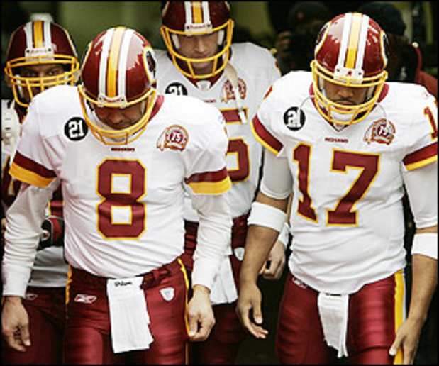 Washington Redskins Sean Taylor (21) and Rock Cartright (31) tie up St.  Louis Rams David Allen on a punt return in the first quarter at the Edward  Jones Dome in St. Louis