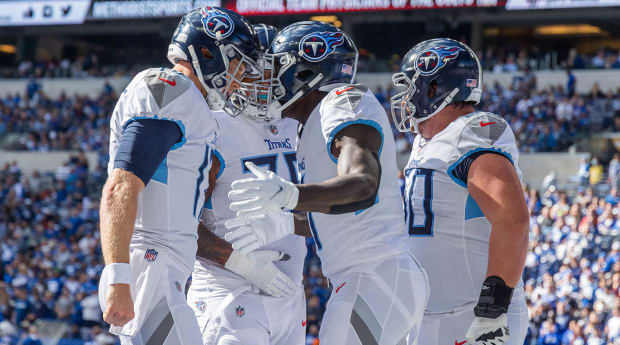 Titans defense shuts down Brady-less Buccaneers 34-3