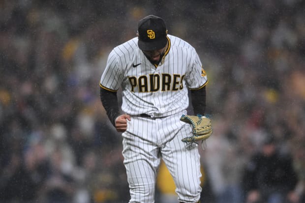 Robert Suarez of the San Diego Padres pitches in the eighth inning