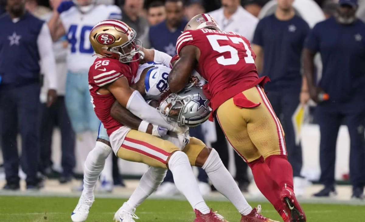 CeeDee Lamb of the Dallas Cowboys scores a touchdown as Isaiah