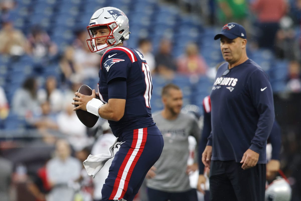 New England Patriots quarterback Tom Brady (12) jokes with New England  Patriots wide receiver Troy Brown before the game against the Jacksonville  Jaguars at Gillette Stadium in Foxboro, Massachusetts on January 12